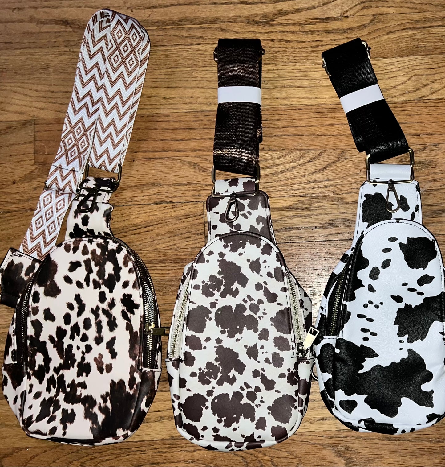 Cow print sling bags