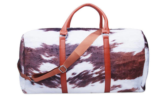 Faux fur cow print duffel bag