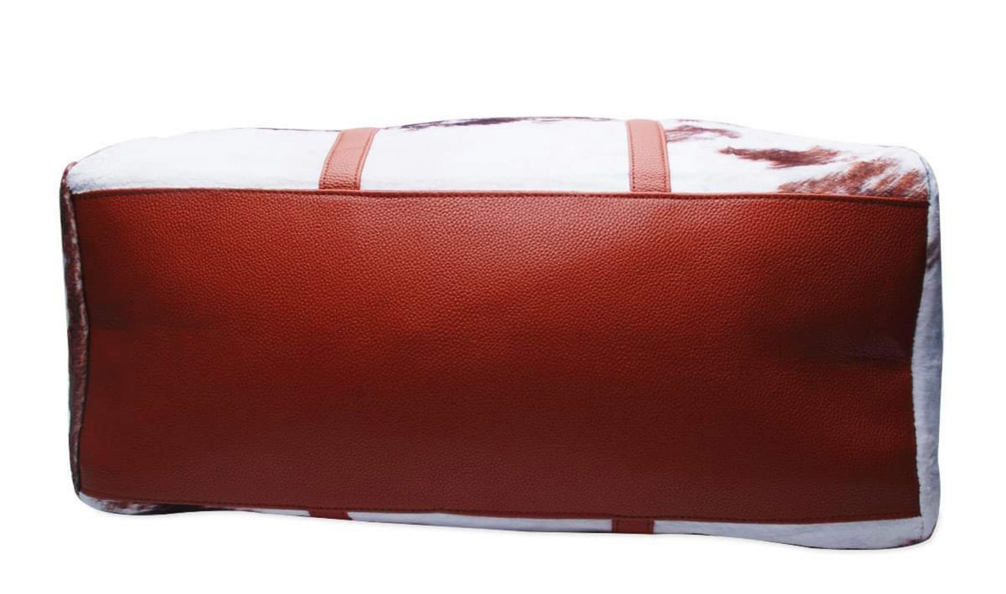Faux fur cow print duffel bag